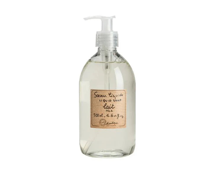 A clear plastic bottle of Lothantigue liquid soap in milk scent with a brown label on it.