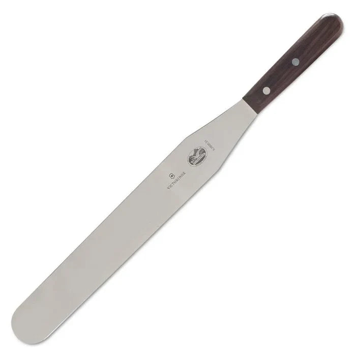 A Victorinox spatula with a stainless steel blade and dark wood handle.