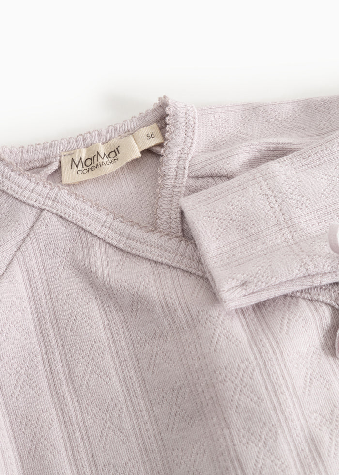 Details of baby bodystocking in light lilac with MarMar Copenhagen brand
