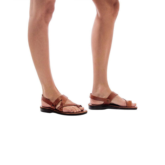 Model wearing Benjamin honey, handmade leather sandals with back strap and toe loop