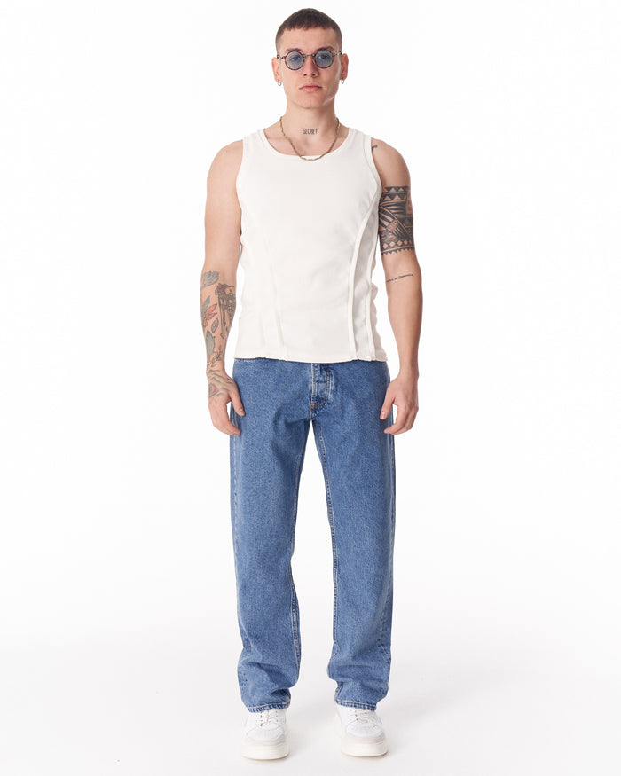 Martin Valen blue loose-fit jeans worn, mid-body front view showing relaxed waist and straight leg