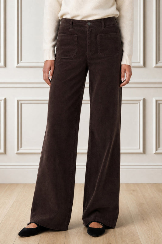 Model wearing the Aspiga Stretch Corduroy Trouser in Chocolate, a wide-leg corduroy trouser with patch pockets, front view