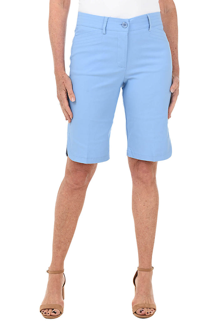 Light blue shorts worn by a person on a white background