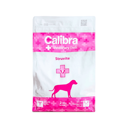A bag of Calibra Veterinary Diets Struvite dog supplement, featuring a white and bright pink design with a dog silhouette.