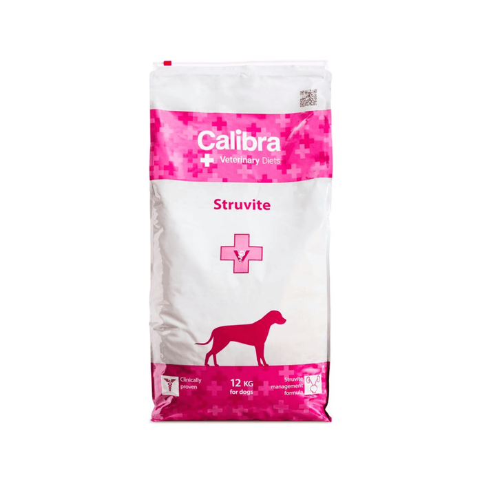 A 12 kg bag of Calibra Struvite veterinary dietary dog food, featuring a white and pink package design with a dog silhouette.
