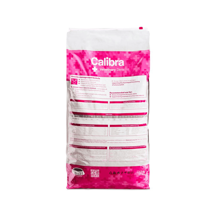 A 20 kg bag of Calibra Veterinary Care dry litter supplement, shown from the back. The packaging is white with a prominent pink patterned band and white text.