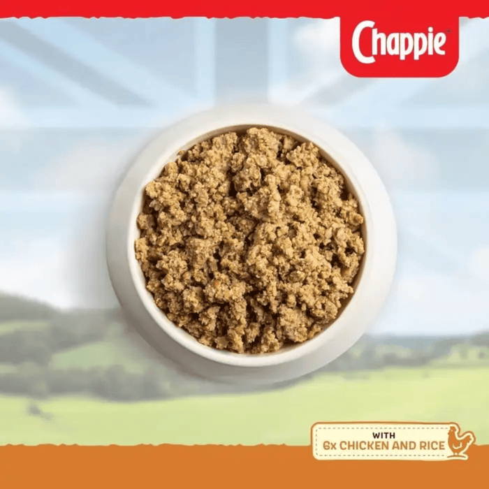 Bowl of Chappie Chicken & Rice dog food with a scenic background.