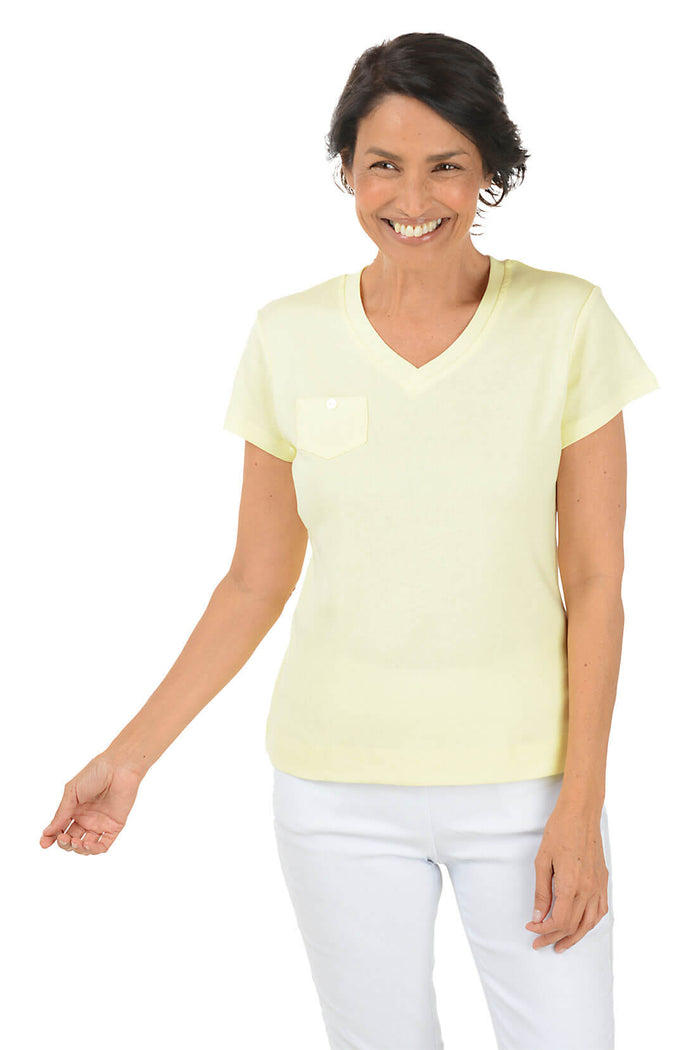 Woman wearing a light yellow V-neck t-shirt on a white background