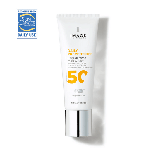 DAILY PREVENTION Ultra Defense Moisturizer SPF 50 | IMAGE Skincare tube standing upright with a silver cap and Skin Cancer Foundation recommended daily use badge, highlighting broad spectrum sun protection.