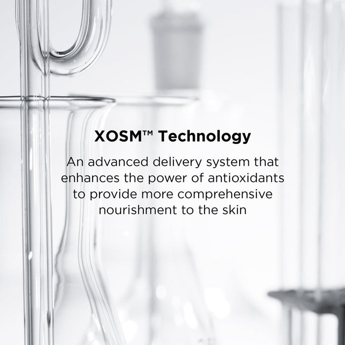 Close-up of clear laboratory glassware with text highlighting XOSM Technology as an advanced delivery system that enhances antioxidants for comprehensive skin nourishment in DAILY PREVENTION Ultra Defense Moisturizer SPF 50 | IMAGE Skincare.