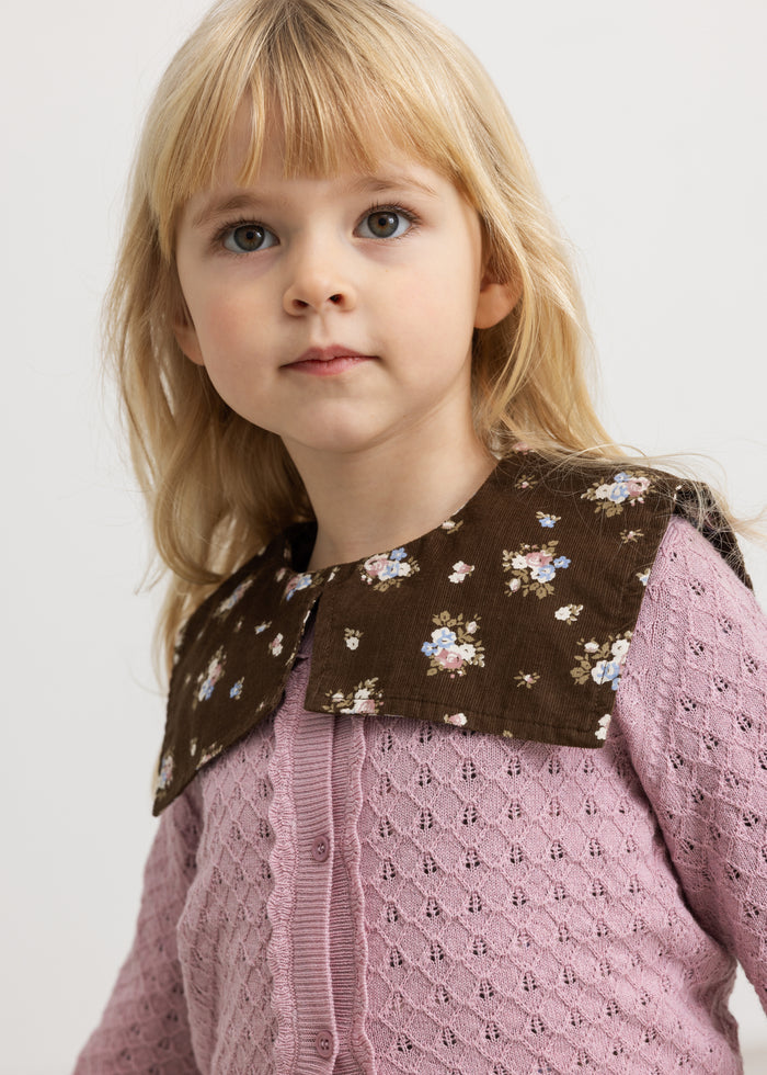 Floral printed dress with a printed top and a pleated collar.