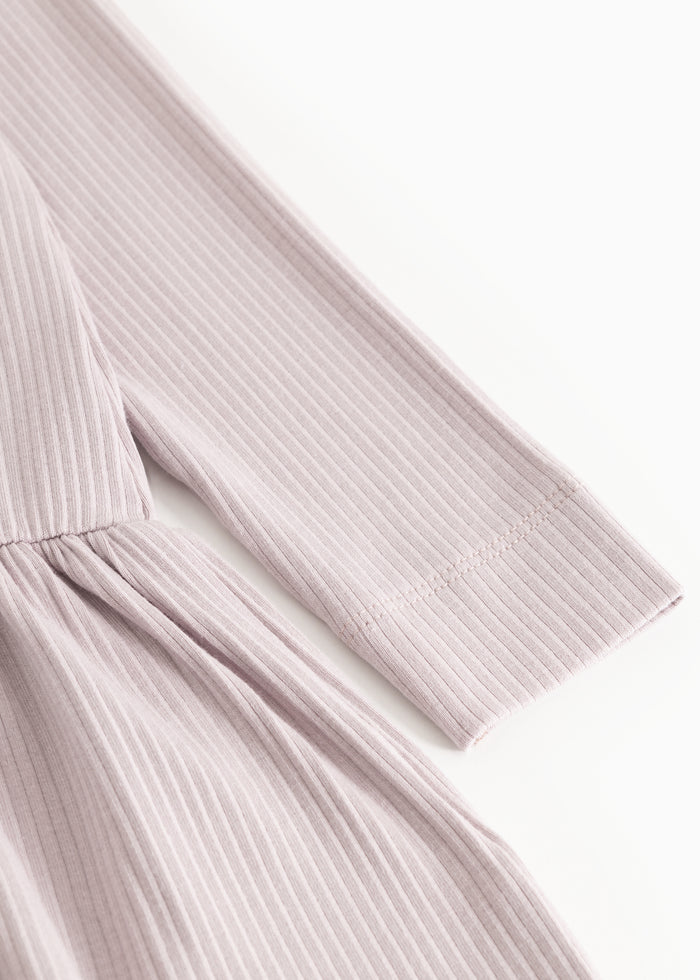 Light gray dress with long ribbed sleeves and a pleated skirt.