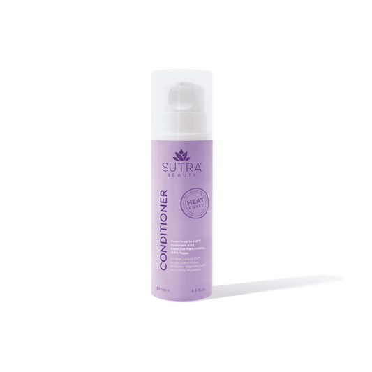 A lavender-colored bottle of Heat Guard Conditioner | SUTRA with a white pump cap, designed to protect hair from heat damage while supporting wellness and care.