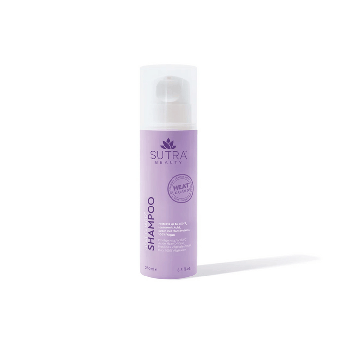 Bottle of Heat Guard Shampoo | SUTRA in light purple packaging with white pump dispenser, promoting hair protection up to 450°F and vegan ingredients for hair care and wellness.