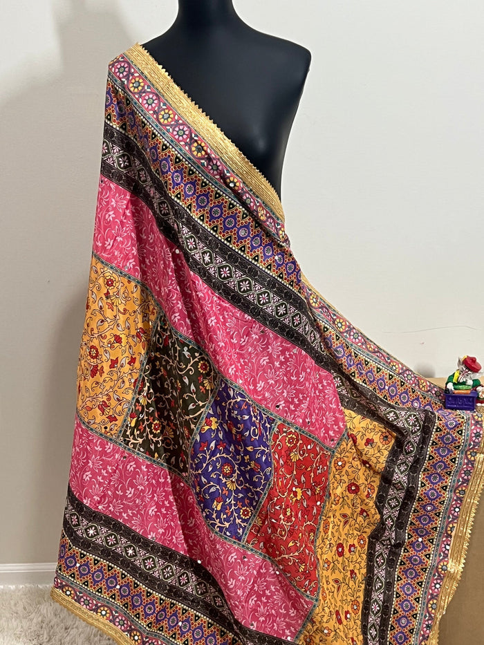 Colorful Malai silk dupatta with patchwork blocks, floral motifs, and gold border draped on a mannequin.