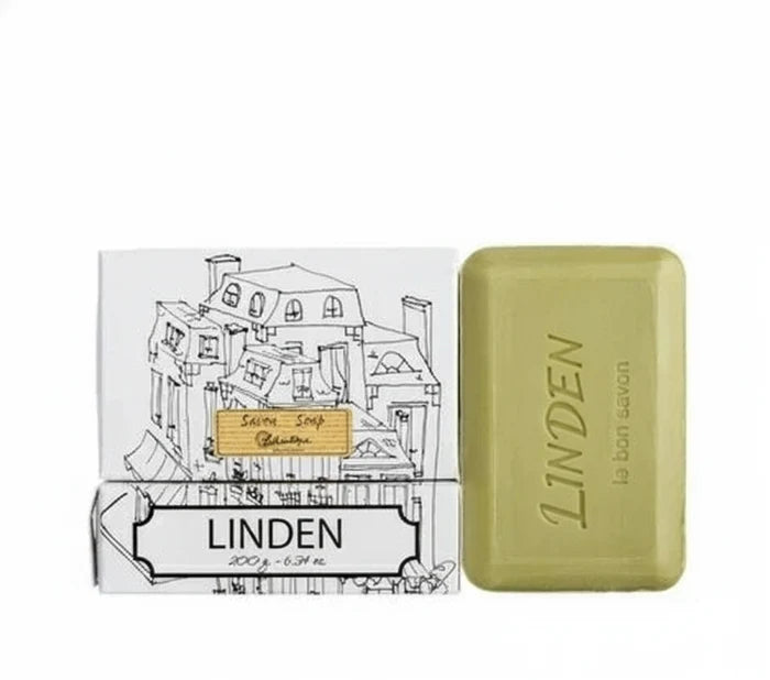 Box of Lothantique - Linden Bar Soap with a sketch of city buildings on it, beside a bar of green bar soap.