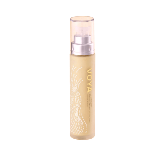 Bottle of Luminosity Refining Radiance Exfoliator | VOYA with a clear pump cap, designed for skincare and body care routine.
