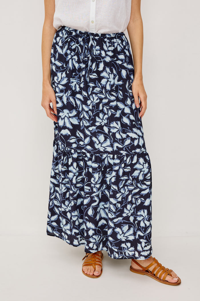 Marulo High-Waisted Floral Maxi Skirt in Pleated Chiffon With Adjustable Drawstring Ties, Single Tier Seam, and Full Interior Lining in Navy Jasmine Colorway - Lower Body Front VIew Featured on Model