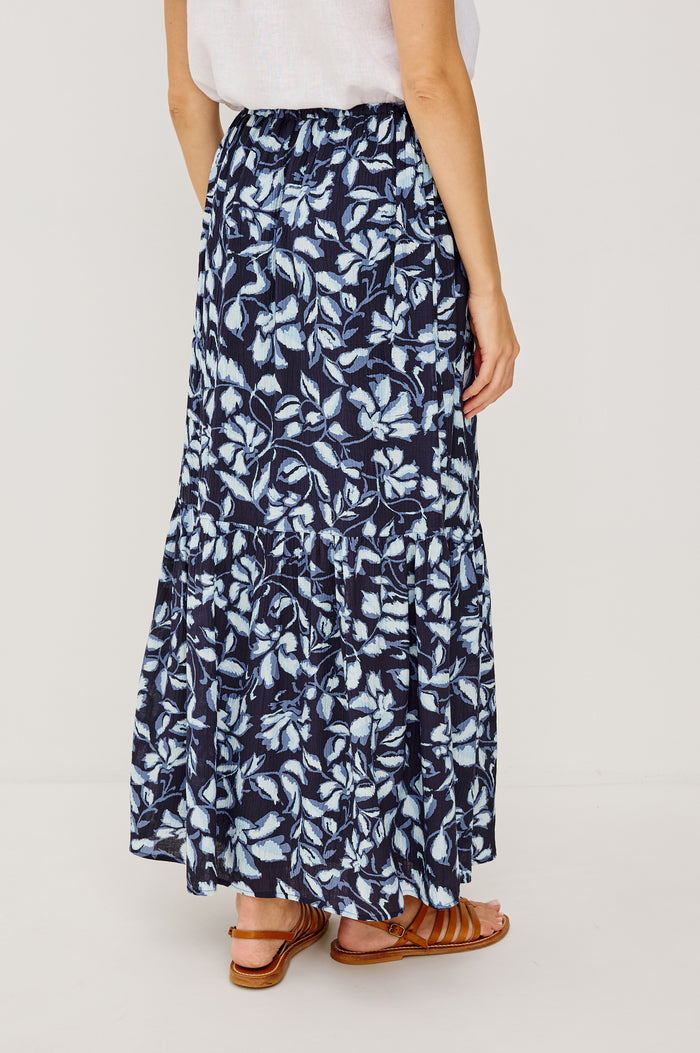 Marulo High-Waisted Floral Maxi Skirt in Pleated Chiffon With Adjustable Drawstring Ties, Single Tier Seam, and Full Interior Lining in Navy Jasmine Colorway - Full Body Back VIew Featured on Model