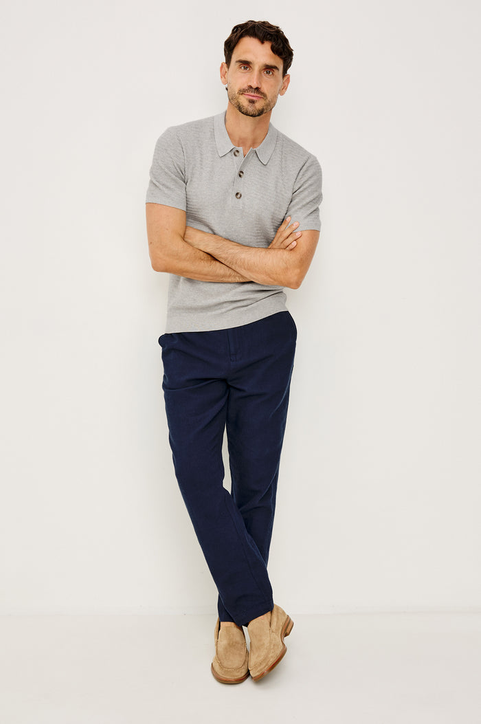 Nathan Polo Shirt in Cotton Blend Knit With Collar, Quarter Button Placket, and Short Sleeves in Heather Grey Colorway - Full Body Front View Featured on Model