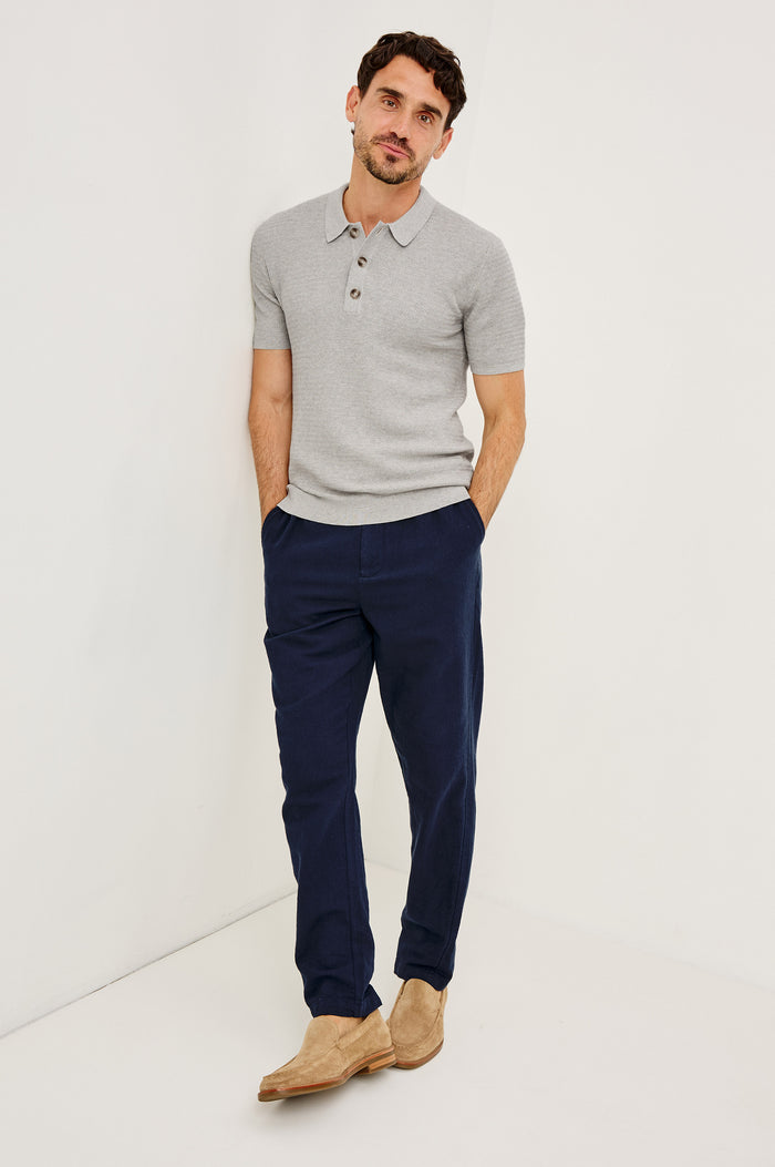 Nathan Polo Shirt in Cotton Blend Knit With Collar, Quarter Button Placket, and Short Sleeves in Heather Grey Colorway - Full Body Front View Featured on Model