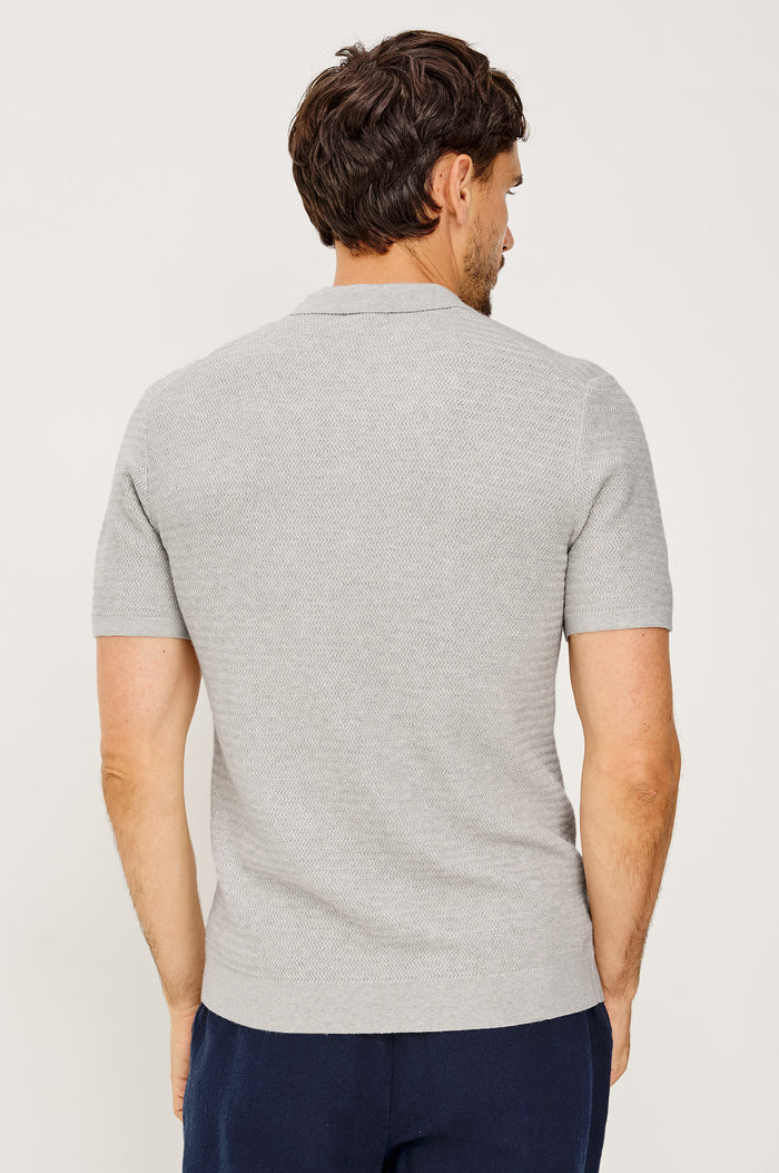 Nathan Polo Shirt in Cotton Blend Knit With Collar, Quarter Button Placket, and Short Sleeves in Heather Grey Colorway - Upper Body Back View Featured on Model