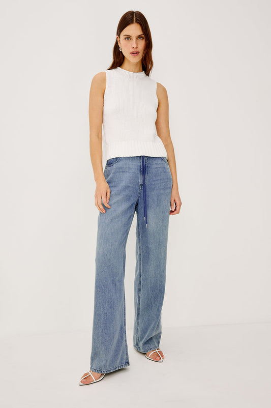 Normandie Pant in Cotton Lyocell Denim With Low-Slung Fit, Adjustable Toggle Drawstring Waist Ties, 5-Pockets, and Loose Fit in Antique Blue Colorway - Full Body Front View Featured on Model