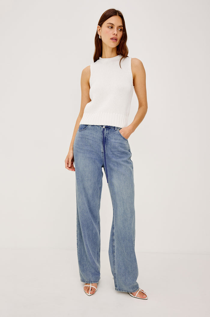 Normandie Pant in Cotton Lyocell Denim With Low-Slung Fit, Adjustable Toggle Drawstring Waist Ties, 5-Pockets, and Loose Fit in Antique Blue Colorway - Full Body Front View Featured on Model
