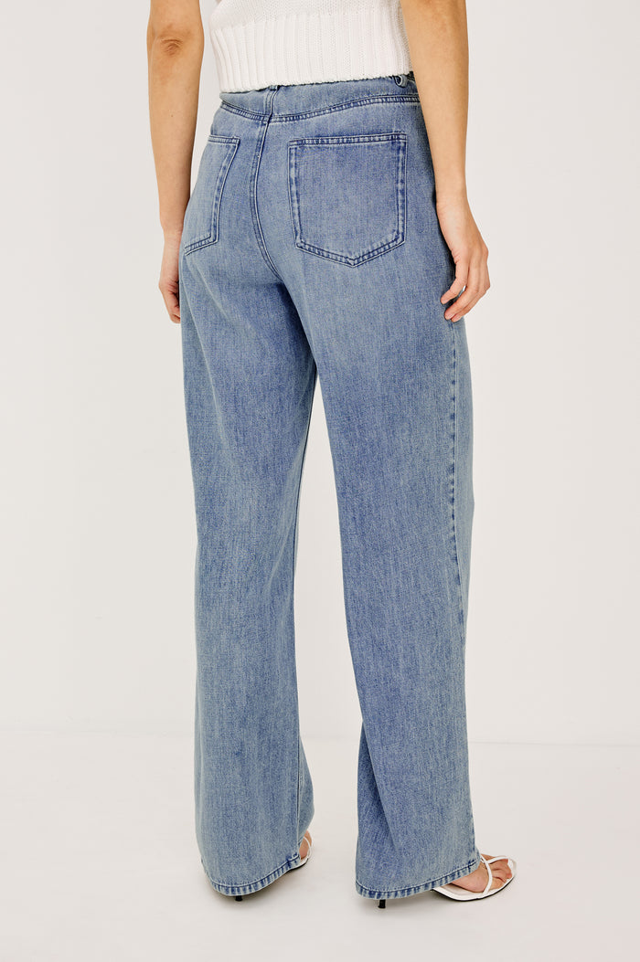 Normandie Pant in Cotton Lyocell Denim With Low-Slung Fit, Adjustable Toggle Drawstring Waist Ties, 5-Pockets, and Loose Fit in Antique Blue Colorway - lower Body Back View Featured on Model