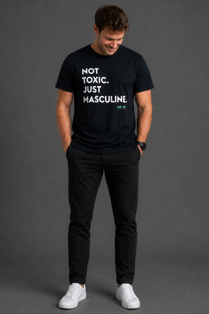 Man wearing a black t-shirt with text on a gray background || Black