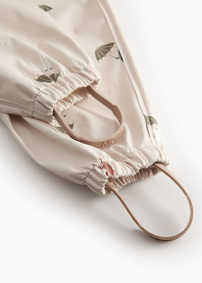 Beige baby raincoat with Moomin print, hat, and booties.