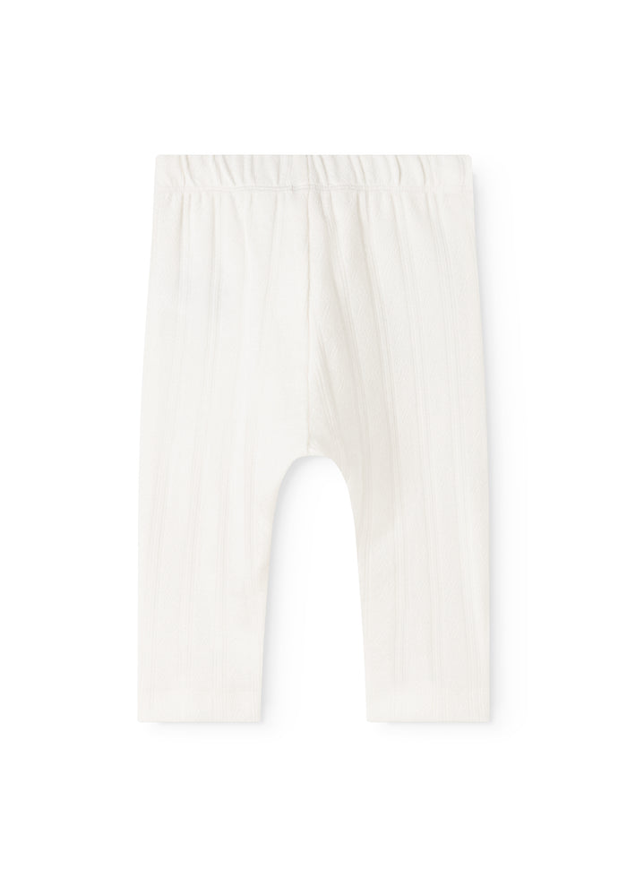 White baby pants from Pitti with a light drop and elastic waistband at the top.