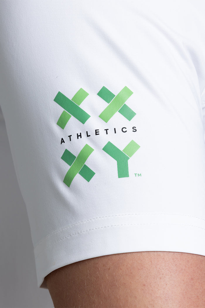 White t-shirt with green brand logo on a plain background || White