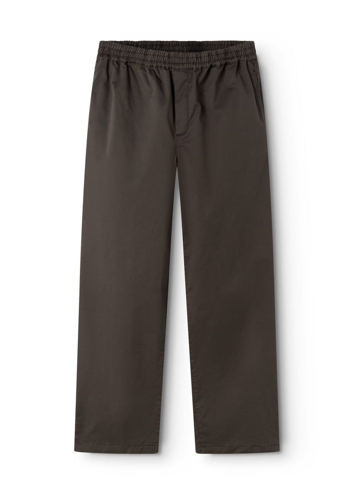 Dark trousers with elastic waistband and seam detail at the seam.