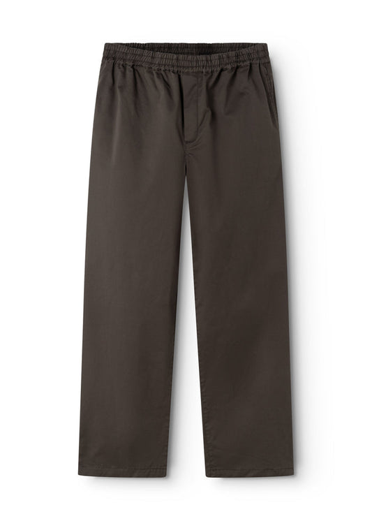 Dark trousers with elastic waistband and seam detail at the seam.
