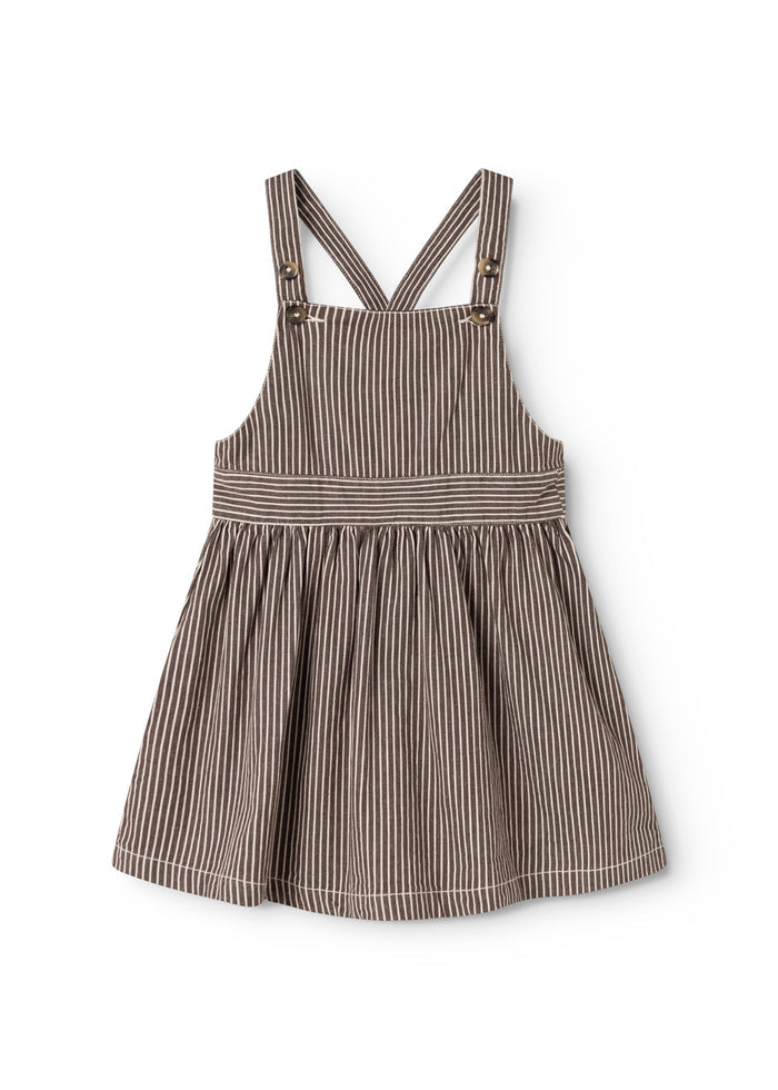Dark brown striped dress with cross straps and pleated skirt.