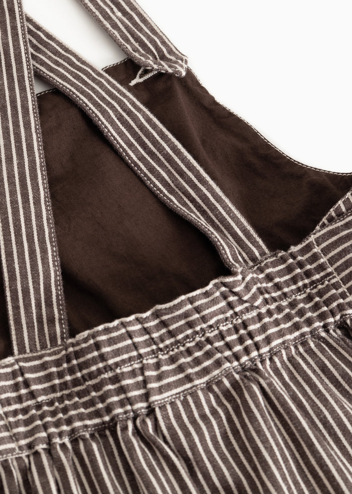 Inside details on dark brown striped dress: gathered waist and straps
