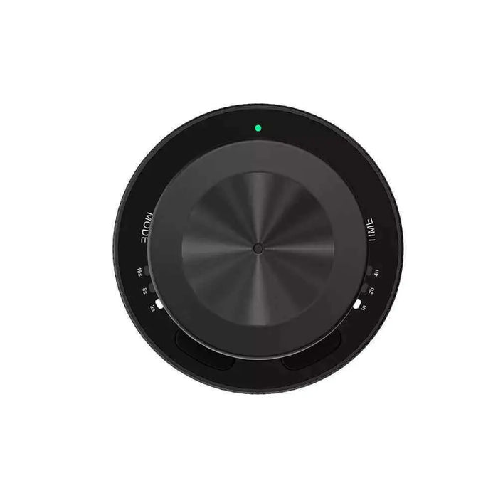Top view of a black electronic volume knob showcasing a sleek, circular design with labeled settings, a green indicator light, and a brushed metal center, mirroring the elegance of ASCENT COLLECTIONs Smart Mini Scent Diffuser Rose Gold rechargeable battery compartment.