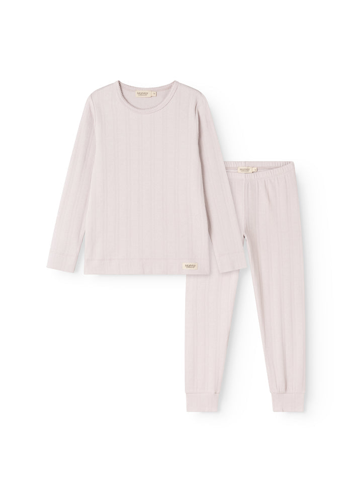 Baby pink pajamas in light purple: long-sleeve top and long pants with ribbed edges.