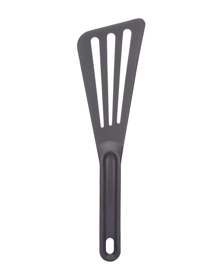 Grey slotted spatula on a white background.