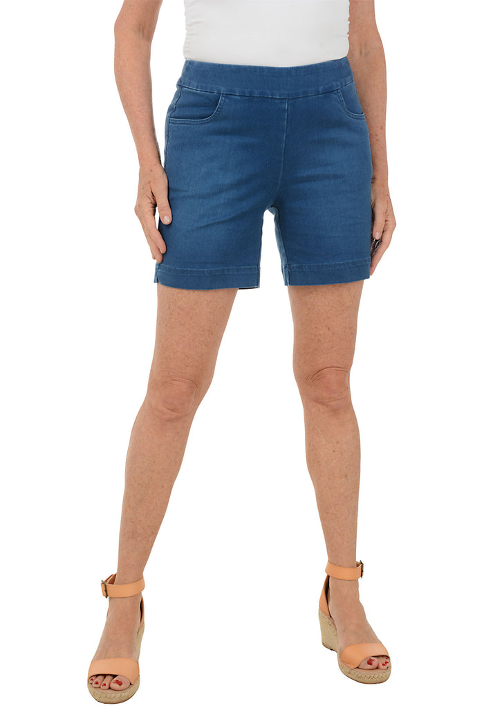 Person wearing blue shorts on a white background.