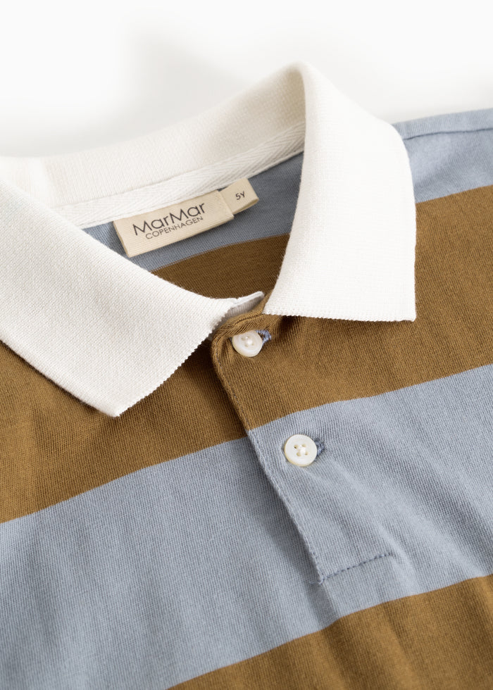 Polokrav and button closure in white and striped fabric, light blue and ochre brown.