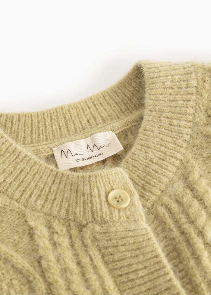 Bright striped vest with collar, ribbed edge and button, and label at the neck.