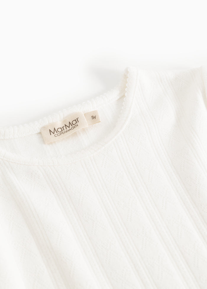 Long-sleeve white t-shirt with crew neck and brand label at the neck.