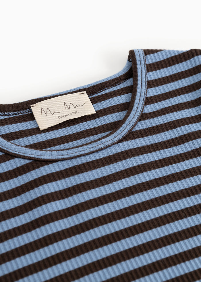 Close-up of the collar and label on a striped long-sleeve T‑shirt