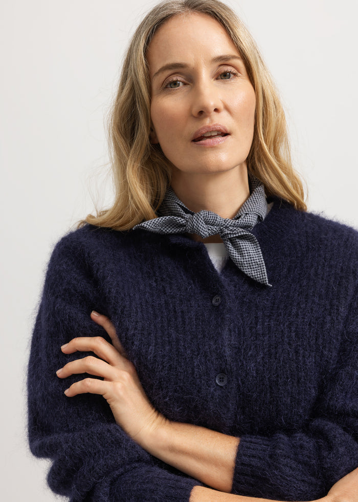 Tavon W cardigan in dark melange with front button closure.