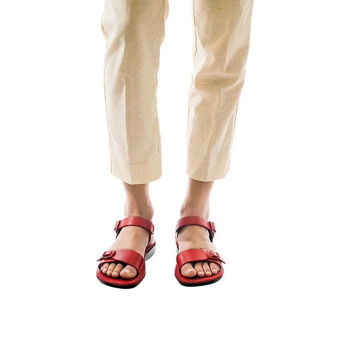 Model wearing The Original red, handmade leather sandals with back strap