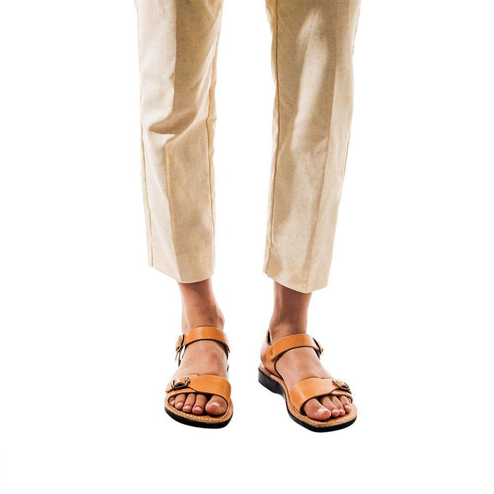 Model wearing The Original tan, handmade leather sandals with back strap