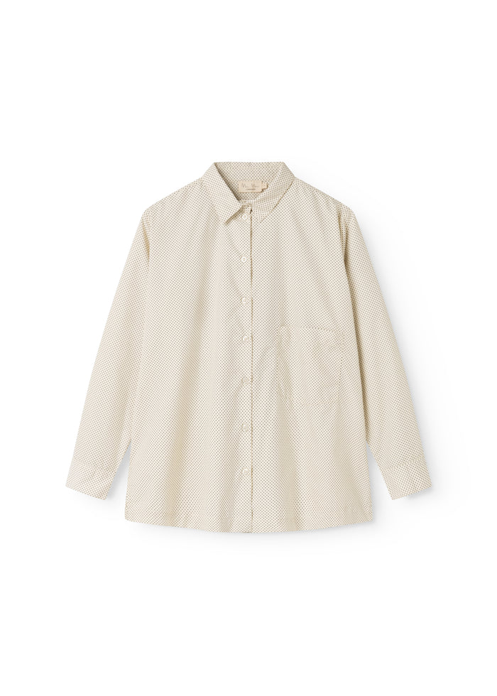 Off-white shirt with small black dots, button closure and long sleeves