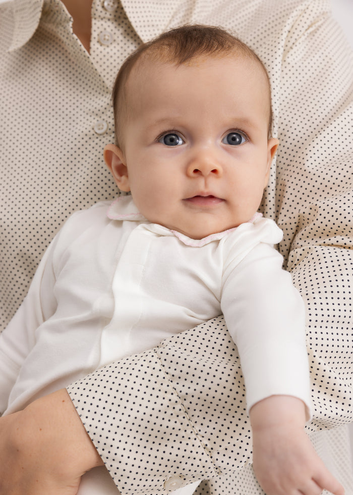 White shirt with small black dots, long sleeves and button closure